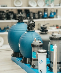 Filters and pool equipment in a well-organized shop.
